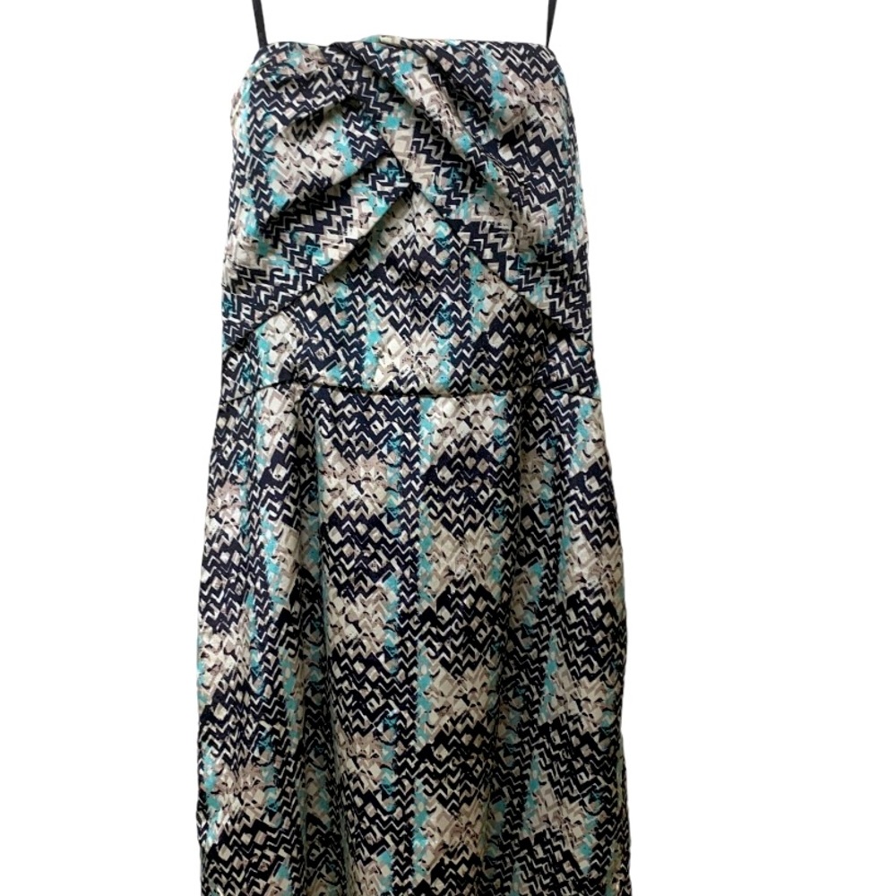 BCBG short strapless black dress with green and beige print.